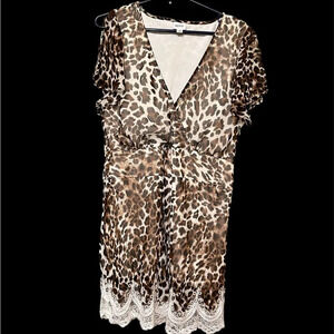 NWOT leopard print top with lace trim.